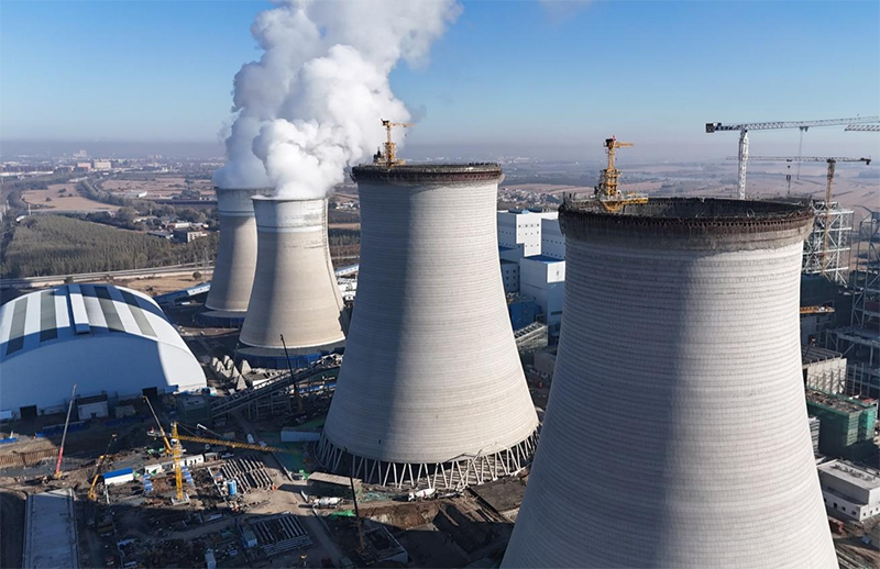 筑顶冰城暖源！国能哈热二期项目3号排烟冷却塔顺利封顶